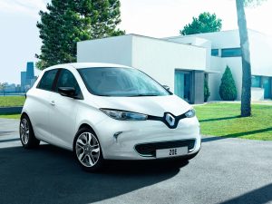 Renault Zoe parked outside a modern whitewashed house in a city suburb