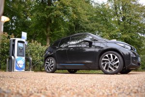 BMW i3 electric vehicle charging at an Ultracharge rapid charge unit in a public area