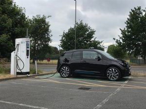 BMW i3 electric vehicle charging at an older Chargemaster unit