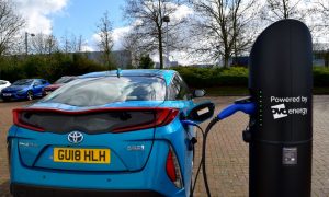 2018 Toyota Prius plug-in hybrid car charging at a fastpost in Milton Keynes